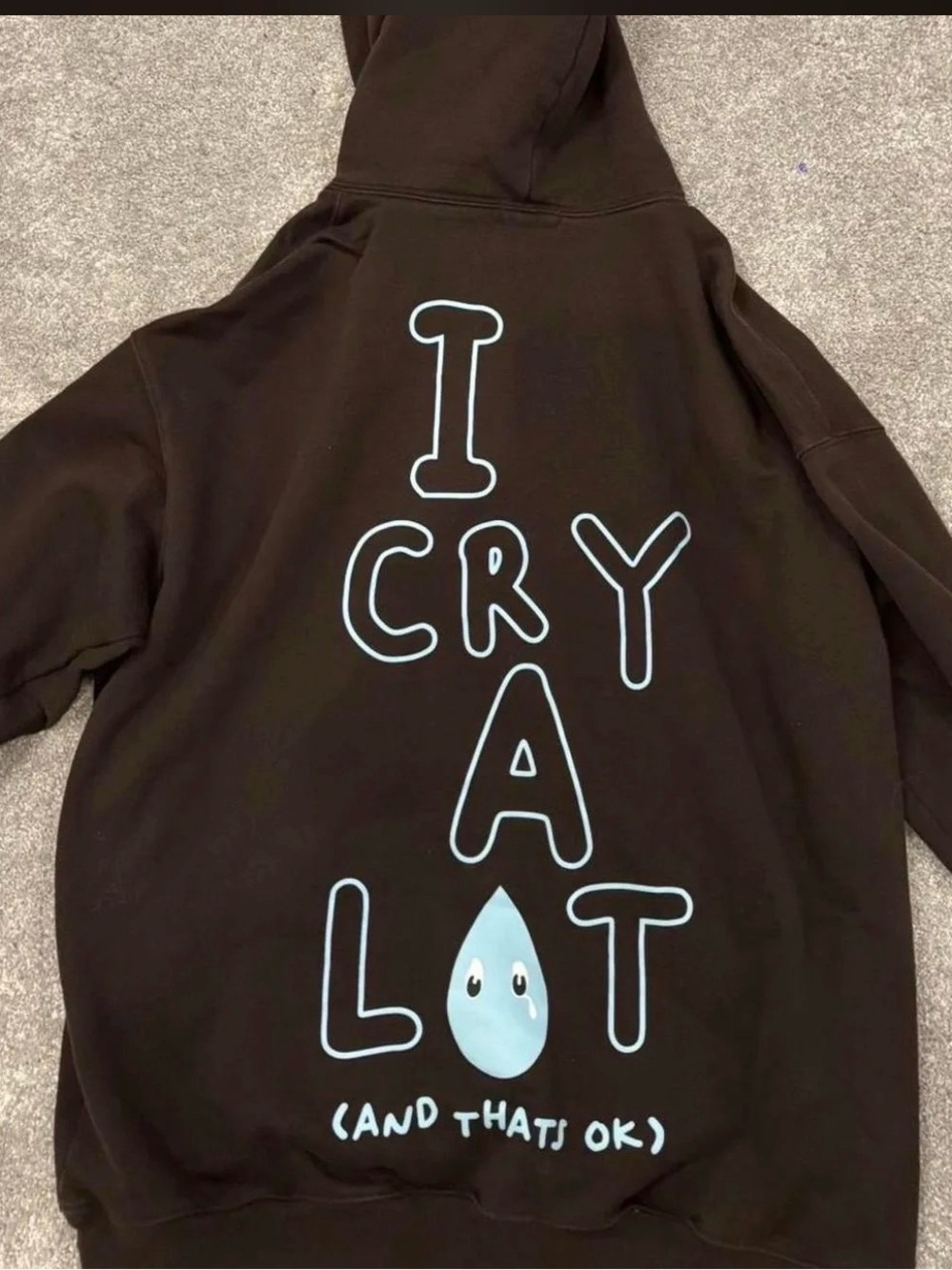 Black Graphic Hoodie with Light Blue 'I Cry A Lot' Design